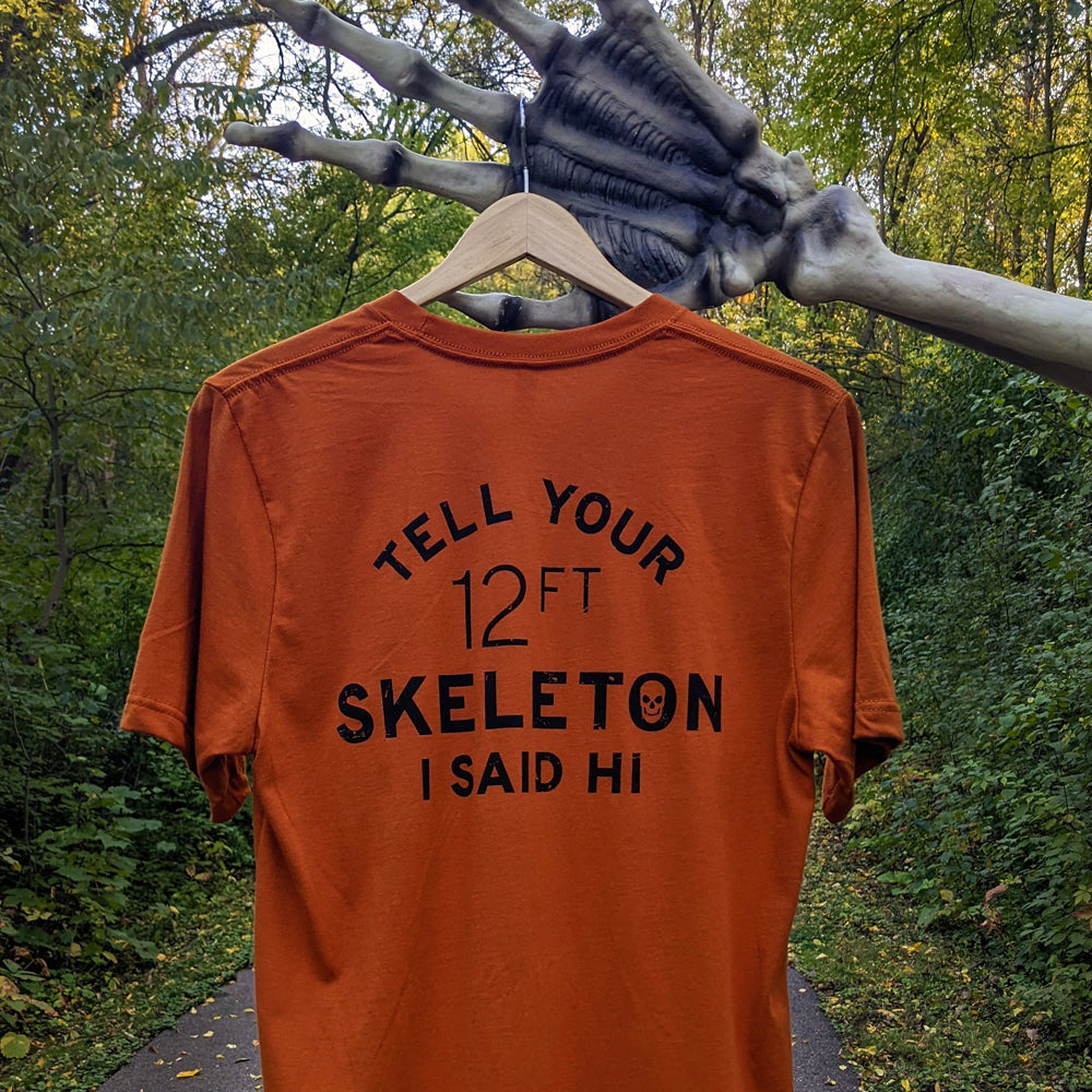 alt="Orange shirt with 12ft skeleton text on the back"
