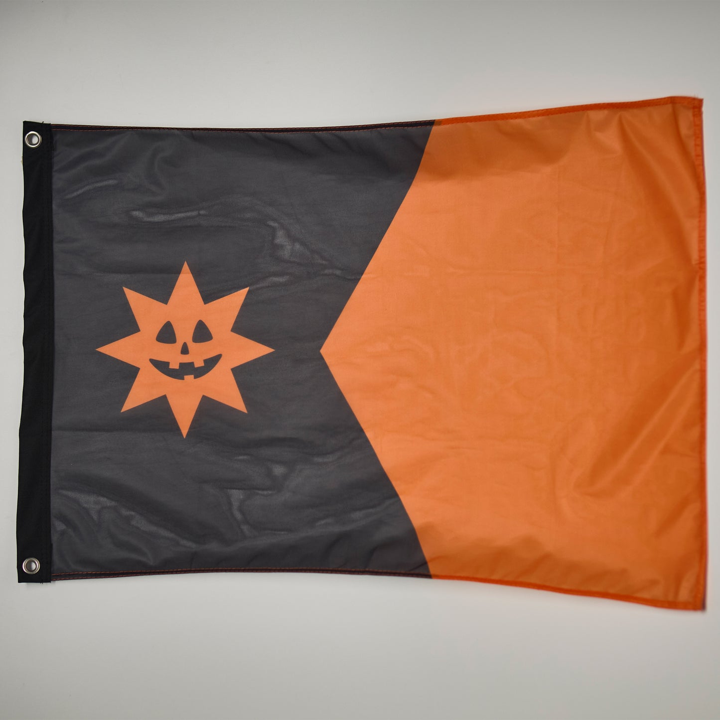 The Minnesota state flag but in orange and black colors with a jack-o-lantern star.