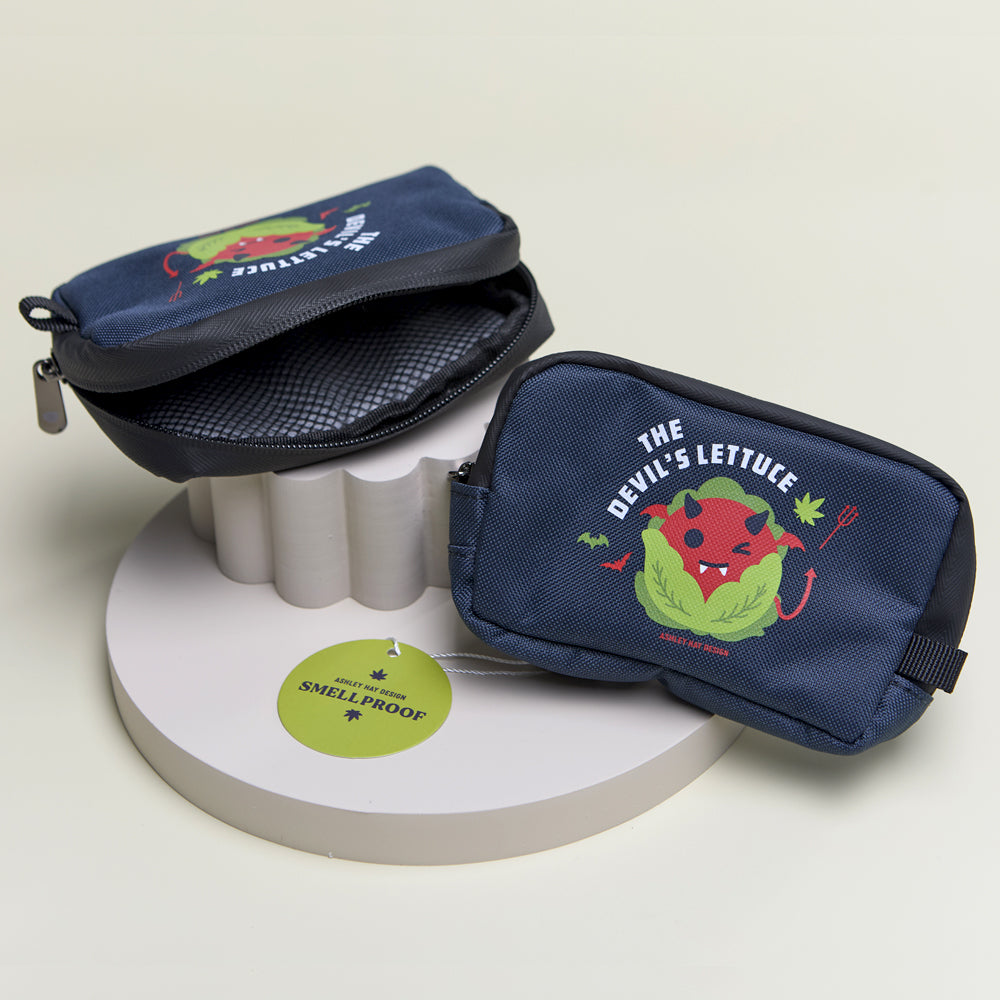 A navy pouch with a winking devil-faced lettuce with the inside net lining showing.