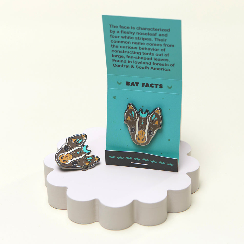 Tent-making bat enamel pin opened