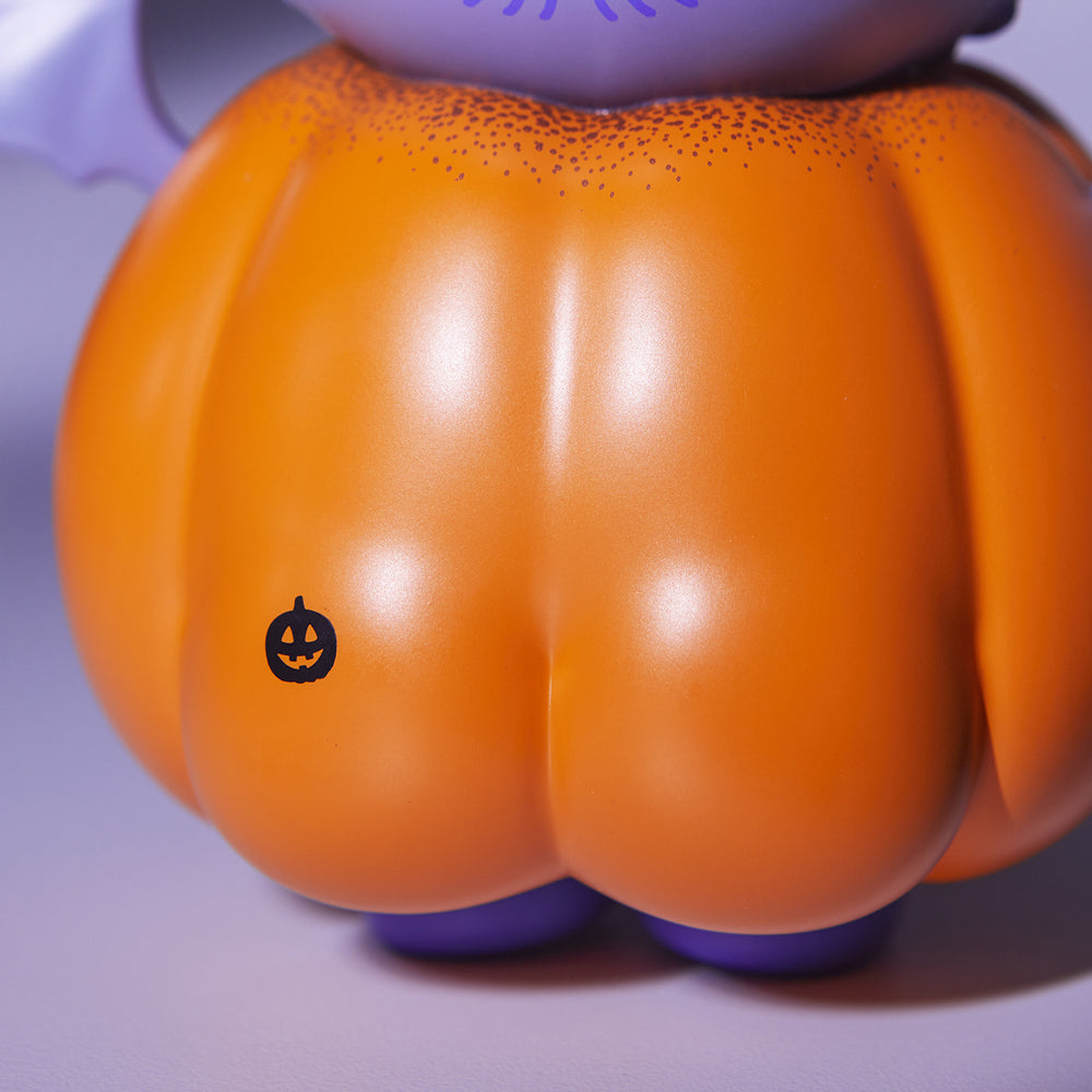 alt="Pumpkin butt with face stamp closeup"