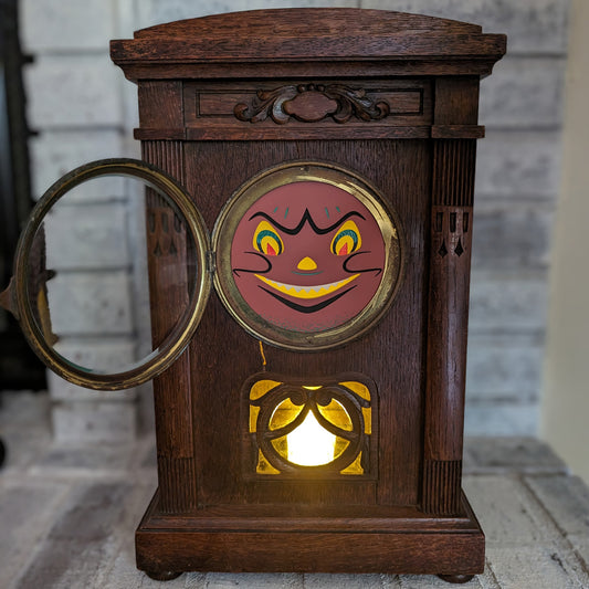 Vintage mantle clock with Halloween face bubble glass lit up