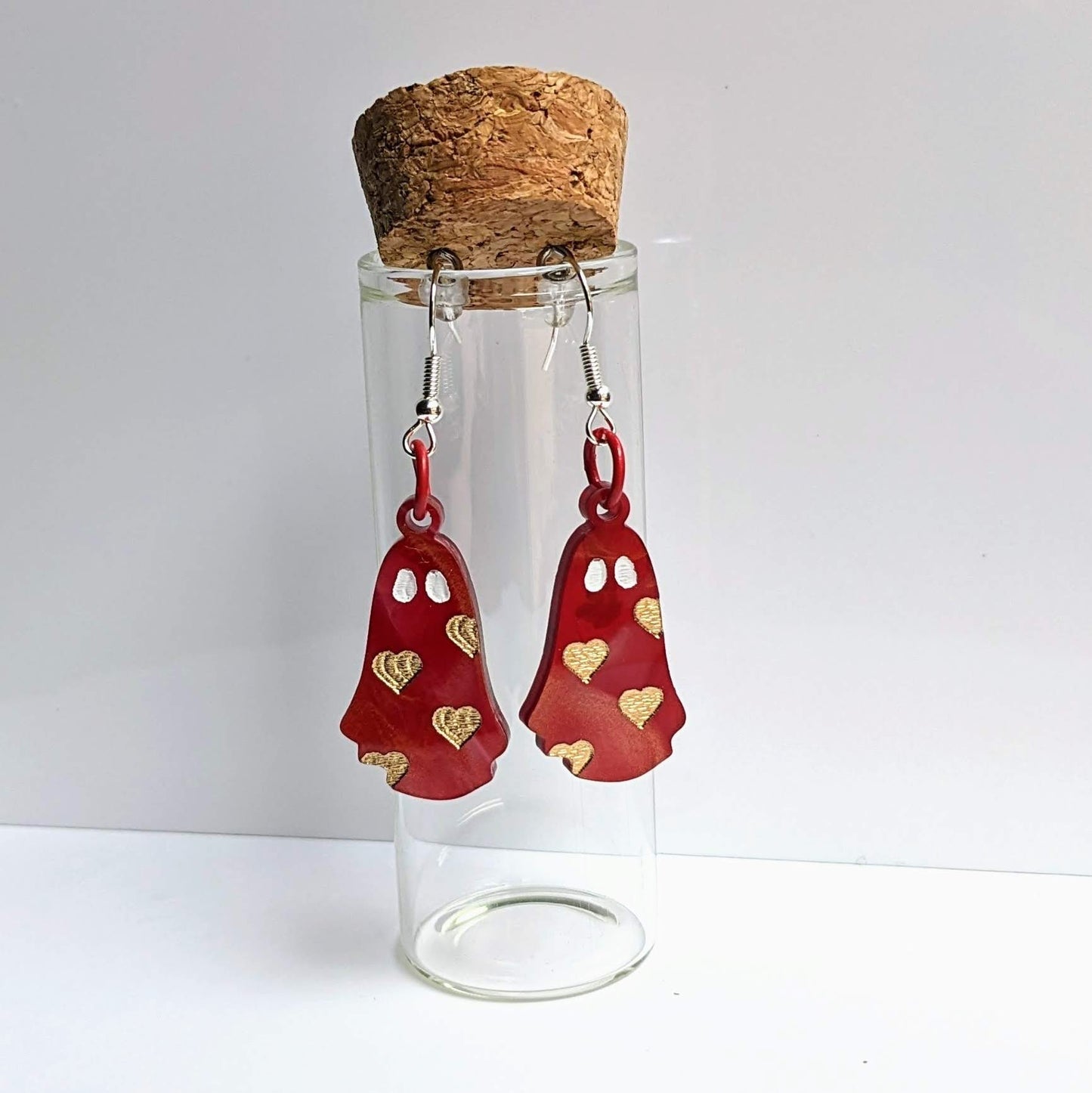 alt="Red and gold acrylic heart ghost earrings"