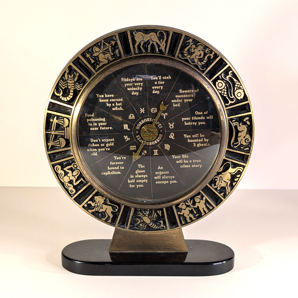 Repurposed metal clock frame with future predictions