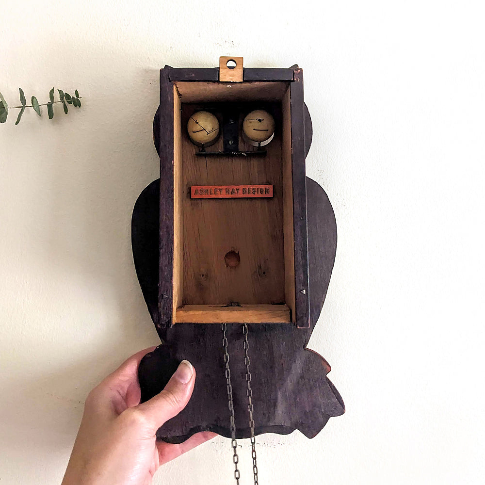 alt="The inside of a Vintage Japanese Owl Clock"