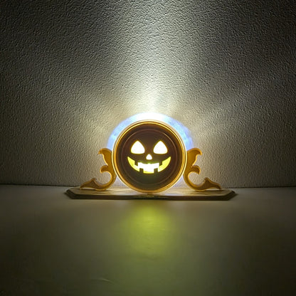 A vintage plastic clock frame repurposed with a yellow jack-o-lantern face. The light inside is turned on. 