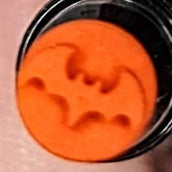 alt="Orange bat makeup stamp"